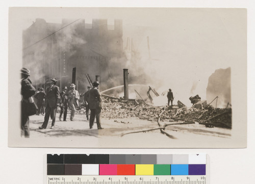 [Crowd in street during fire. Unidentified location.]