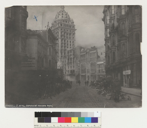 O'Farrell St. Ap. 20/06. [verso:] N.W. cor. Grant Ave. & Market & O'Farrell. Ap. 18 [?], 1906. [Soldiers in formation along street.]