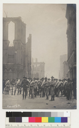 Troops in front of Masonic Temple after fire [..illegible..] their return to their different posts. N.W. cor. Post and Montgomery. 1906. [No. 108 - R.]