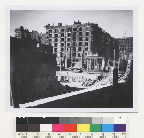 [Ruined lot, South of Market district. Palace Hotel in distance, center.]