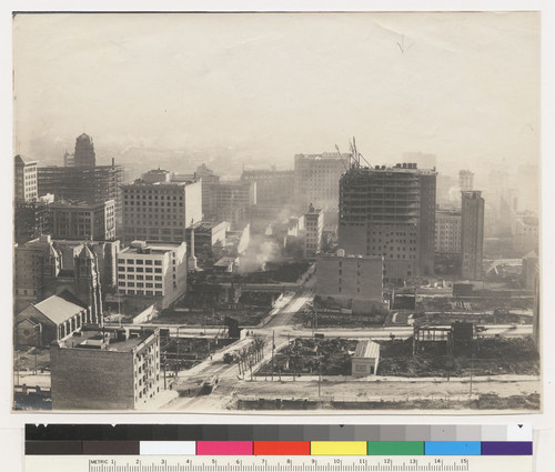 Powell St. down from Bush. St. Francis Hotel in course of construction. [Dome of Humboldt Savings building in distance, left; Union Square, center.]