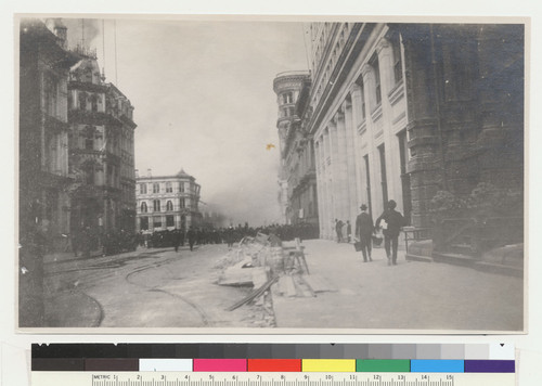 [Crowd in street watching fire. Unidentified location.]