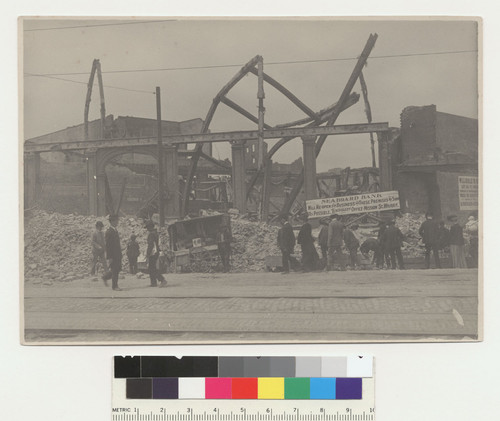 [Street scene showing vendors and shoppers at makeshift stalls. Unidentified location.]