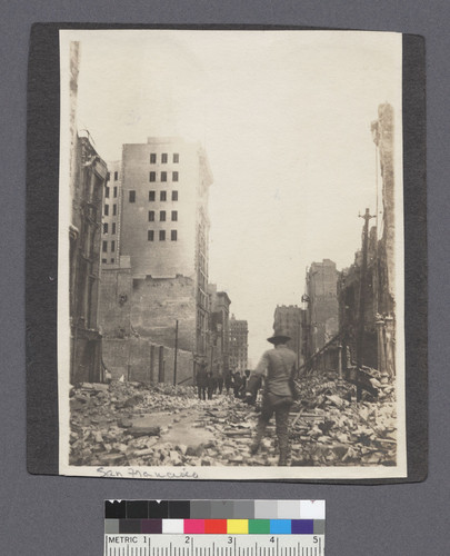 San Francisco. [Soldier walking through debris, unidentified street.]