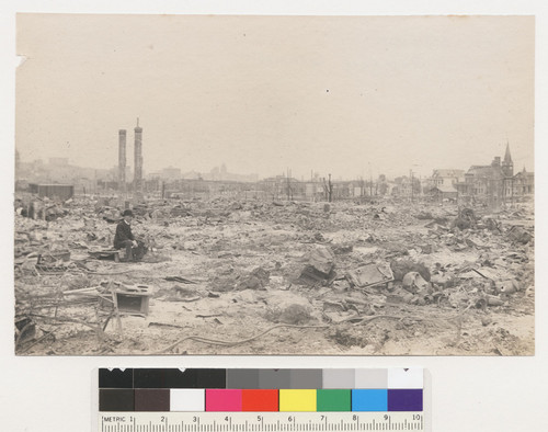 Looking toward Mission St. [Man sitting among ruins.]