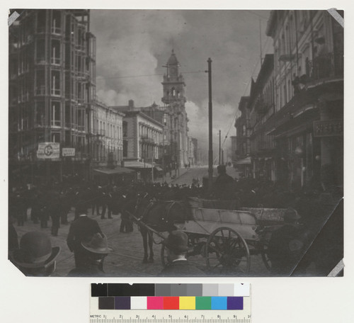 Montgomery St. (500 block.) [Actually Kearny St., looking south from Montgomery Ave. toward Hall of Justice, center. Crowd gathered to watch fire.]