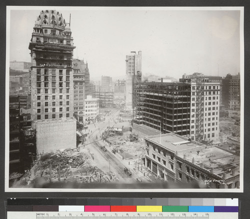 [Call Building (left) and Monadnock Building (right) during reconstruction. Intersection of Third, Market, Kearny and Geary Sts., center.]