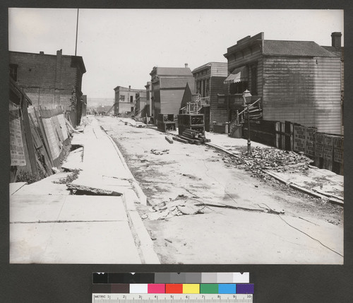 [Subsidence of street and sidewalk. Dore St.]