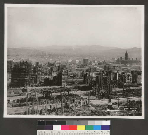 [Panoramic view of city from atop Fairmont Hotel, Nob Hill. View looking southwest from Nob Hill toward Market St. and City Hall (right).]