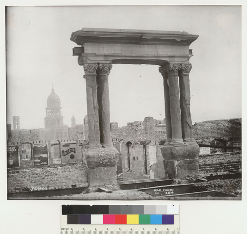Arches. [Façade, unidentified building. City Hall in distance.]