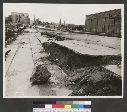 [Subsidence of street and sidewalk along Capp St.]