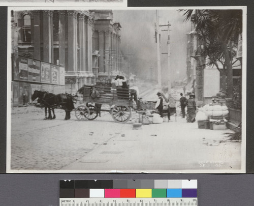 [Refugees loading wagon during fire. Larkin St.? City Hall in distance, left.]