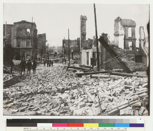 [Ruins and rubble along unidentified street.]