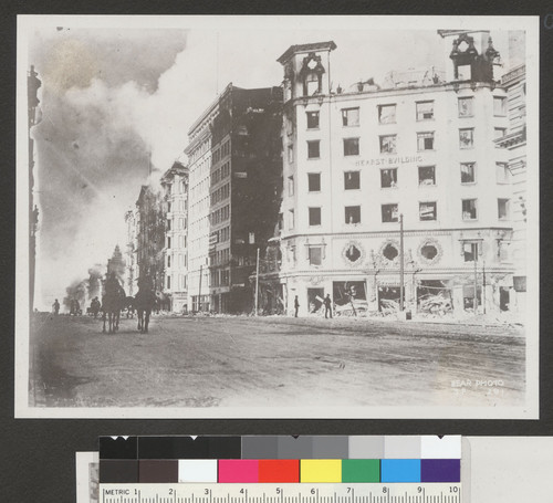 [View east on Market St. from near Third St. during fire. Palace Hotel burning, left center; Hearst Building, right.]