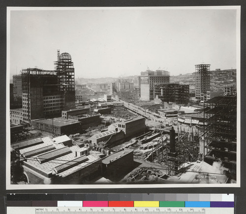 [Cityscape during reconstruction, looking northwest from above circa Third and Howard Sts. Humboldt Building, left; intersection of Market, Grant and O'Farrell Sts., right center.]