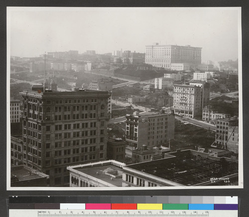 [Cityscape from above circa Kearny and Post Sts. looking northwest toward Nob Hill. Fairmont Hotel in distance, right center.]