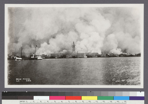 [View of city burning from San Francisco Bay. Ferry Building, center.]