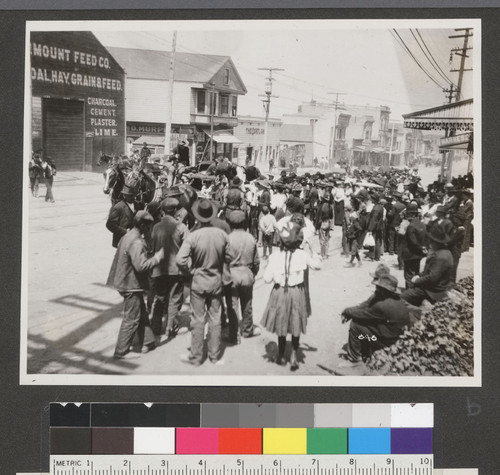 [Street scene. Relief line at wagon? Unidentified location.]