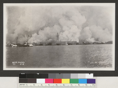 [View of city burning from San Francisco Bay. Ferry Building, center.]