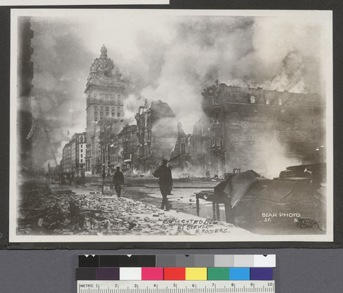 [Officers patroling Market St. during fire. View northeast from vicinity of Ellis and Stockton Sts. Call Building, left center.]