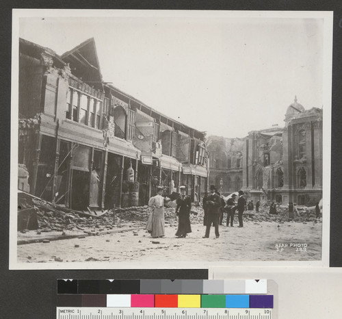 [Street scene of ruined block near Golden Gate and Hyde Sts. Dome of portion of City Hall in background, right.]