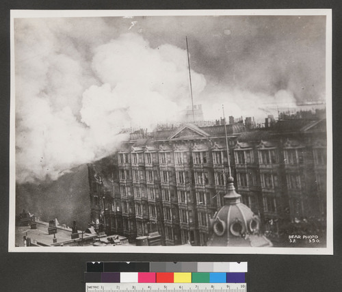 [Palace Hotel on fire. Roof and tower of Grand Hotel, foreground. Market and New Montgomery Sts.]