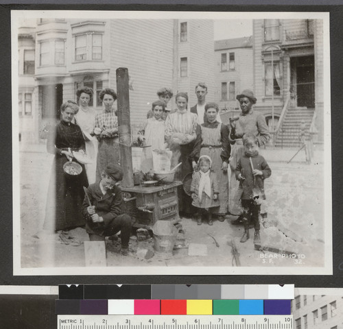 [Group gathered at street kitchen. Unidentified location.]