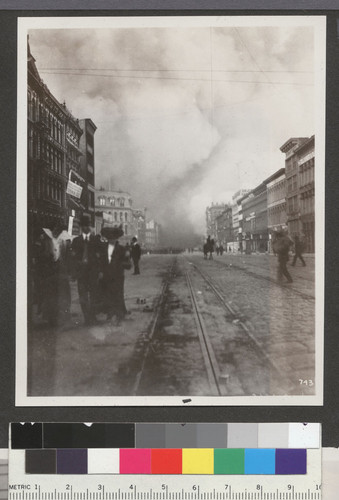 [Street scene showing fire in distance. Market St.?]