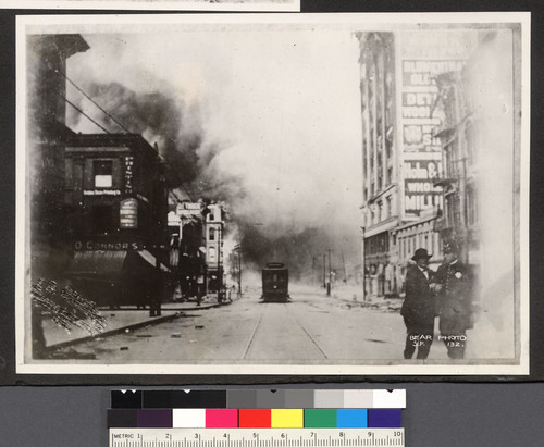 [Street scene of approaching fire. Third and Mission Sts. from Market.]