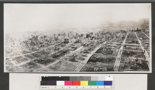 [Aerial view of city in ruins. Taken from above Nob Hill, looking southeast toward Fairmont and Call Building, center.]