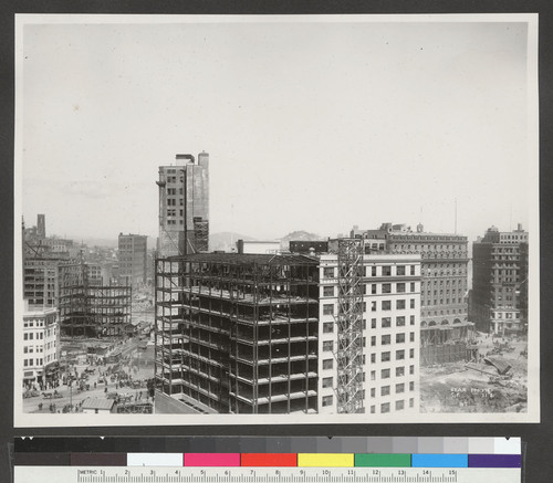 [Monadnock Building during reconstruction. Intersection of Market, Third, Kearny and Geary Sts., left.]