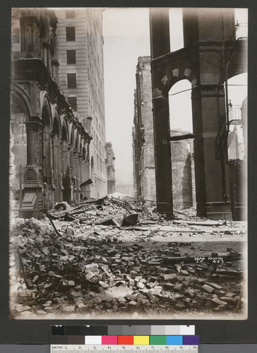 [Ruins and rubble along unidentified street.]