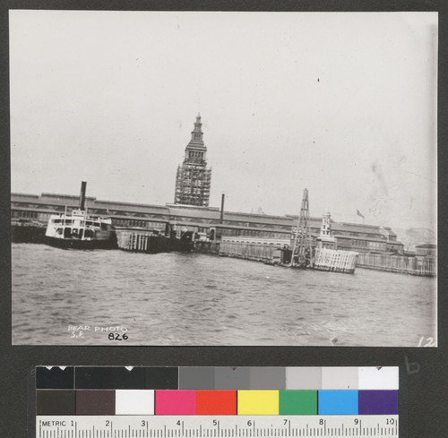 [Ferry Building during reconstruction. As seen from approach to slips in San Francisco Bay.]