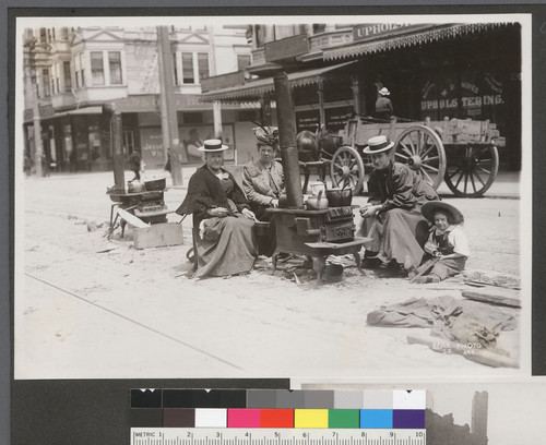 [Women and child at street kitchen.]