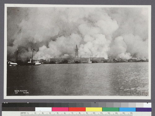 [View of city burning from San Francisco Bay. Ferry Building, center.]