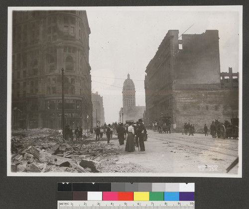 [Street scene. Market St. looking east from Powell and Eddy. Flood Building, left; Call Building in distance, center; Emporium department store, right.]