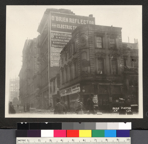 [Street scene of earthquake damage to commercial buildings. Unidentified location.]