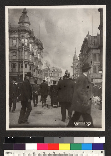 [View down Grant St. toward Market with fire in distance.]