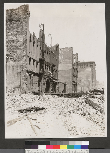 [Ruins and rubble along unidentified street.]