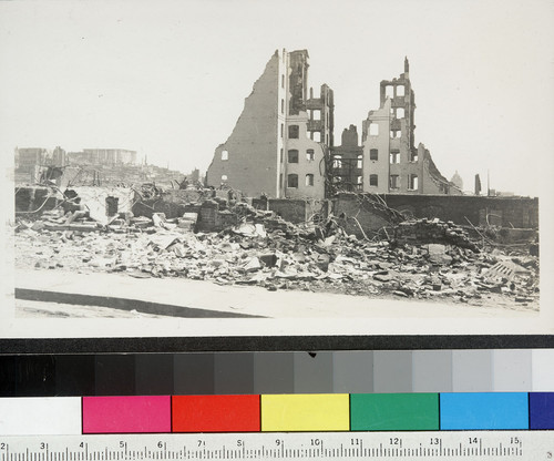 [Ruined building & rubble. Unidentified location. Fairmont Hotel atop Nob Hill in distance, left.]