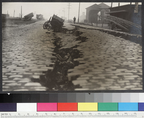 [Wagon in fissure in street.]