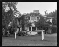 Will Rogers ranch house, exterior view of the north-facing side and hitching post, Pacific Palisades, 1935
