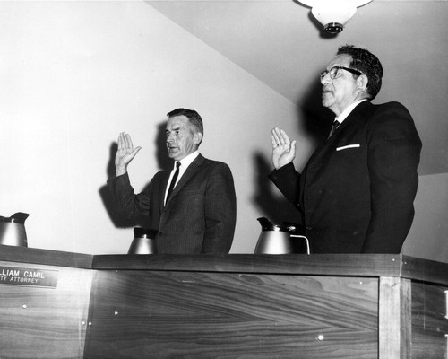 Charles F. Scheibler and George Chavez taking oath of office