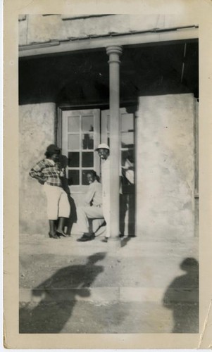 Group on front porch of building