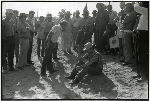 Cesar Chavez debating with a grower