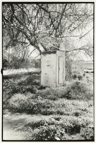 Outhouse in field