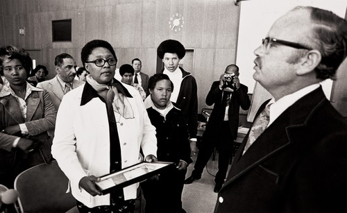 Mrs. Frances Tatum with her two sons receiving a proclamation : May 14, 1975 ; the proclamation from the Ventura County Board of Supervisors renamed Juvenile Hall, Clifton Tatum Center