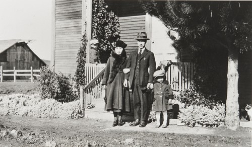 Little William Nagano porch. Teruko Tani and husband with little Patrick Nagano. Nagano Farm : 1921