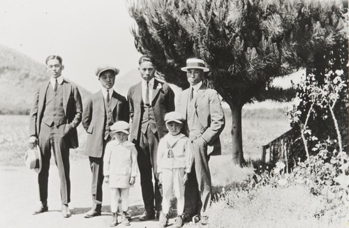 Three Japanese farm workers with Yoshio "George" Nagano and sons Patrick and William. Nagano Farm, Morro Bay : 1922