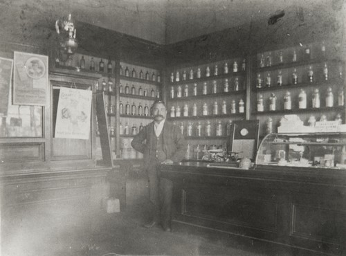 "Doc Cota, clerk at the Marquis Drug Store